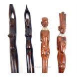 A pair of African carved hardwood salad servers and two similar