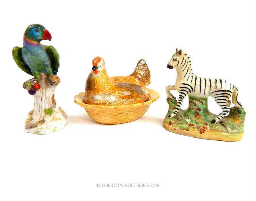 A Staffordshire Zebra, Meissen style parrot and chicken tureen with cover