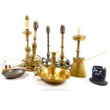 A collection of brass table lamps and other items