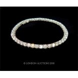 A 14k White Gold Diamond set Line Bracelet.