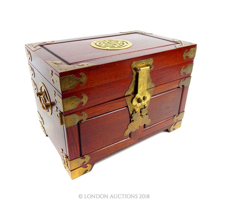 A Chinese hardwood jewellery box, containing jewellery