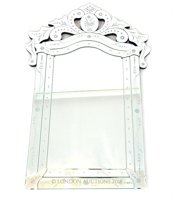 A Venetian style wall mirror