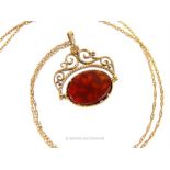 A Vintage 9 ct gold Openwork and Bloodstone twist fob pendant on 9 ct gold chain.