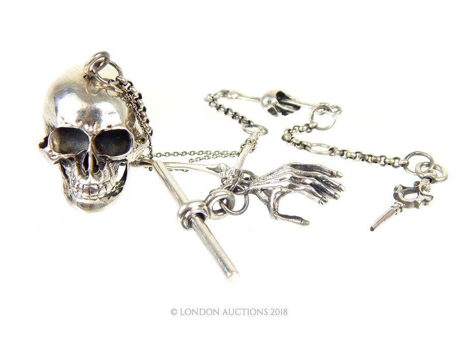 A sterling silver skull trinket box on a matching Albert style chain