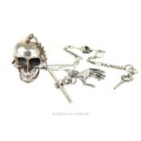A sterling silver skull trinket box on a matching Albert style chain