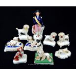 A collection of Victorian Staffordshire figures of dogs