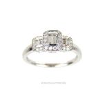 An 18 ct white gold and 3 cluster diamond ring (0.60 carats)