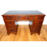 A mahogany pedestal desk