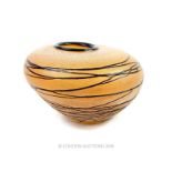 An asymmetrical glass vase
