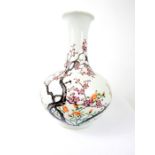 A Chinese porcelain vase, painted in the famille rose palette