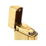 A Dunhill 70 cigarette lighter, gold plated