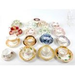 A collection of 19th century tea cups and saucers