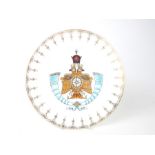 A porcelain plate with Persian Pahlavi crown and a coat of arms