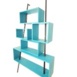 A blue painted Modernist shelving unit