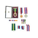 A Territorial medal land 2nd WW medals awarded to Lt. T A Viccars TD. Together with dress medals.