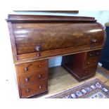 A Victorian mahogany cylinder fronted pedestal desk