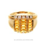 A 14 Carat Yellow Gold Citrine and diamond ring.