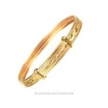 A 9 carat yellow gold Child expanding bracelet