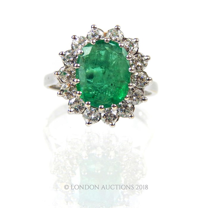 A good 18 Carat White Gold Emerald and Diamond Cluster Ring. - Image 3 of 4