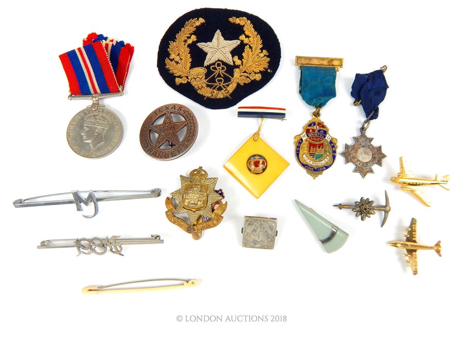 A collection of medals, badges & pins