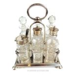 A Walker and Hall silver plated cruet set.