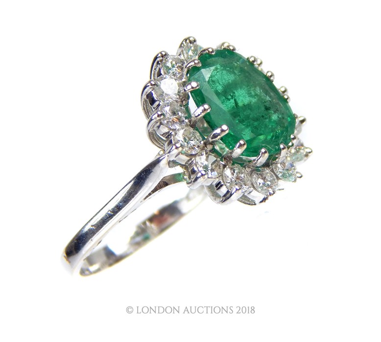 A good 18 Carat White Gold Emerald and Diamond Cluster Ring. - Image 2 of 4