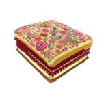 A Victorian embroidered foot stool