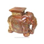 An Oriental ceramic stool in the form of an elephant