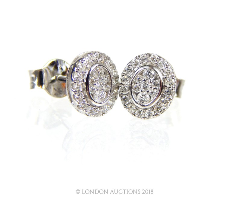 A Pair of White Gold and Diamond Stud Earrings. - Image 3 of 3