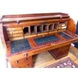 A Victorian mahogany cylinder fronted pedestal desk