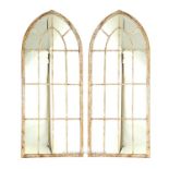 A pair of Gothic style garden mirrors