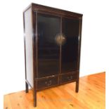 A Chinese black lacquered cabinet