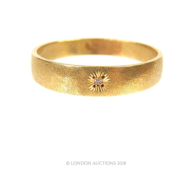 A Gentleman's Solitaire diamond band ring set in 14 carat yellow gold.