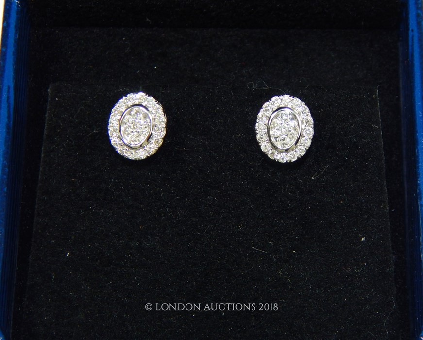 A Pair of White Gold and Diamond Stud Earrings. - Image 2 of 3