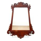 A George III mahogany framed fretwork mirror