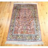 A Persian silk Kerman rug