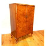 A Gardner & Son Ltd small gentleman's burr walnut wardrobe