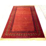 A Persian design rug with a red field