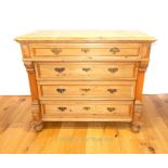 A Continental pine chest of four long drawers