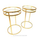 A pair of contemporary circular mirrored and gilt metal occasional tables