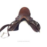 A Farrington's brown leather saddle
