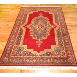 A Persian design machine made rug