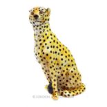 An Italian glazed and painted terracotta sculpture of a leopard