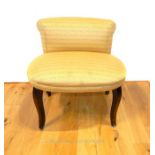 A contemporary designer side chair, with gold coloured upholstery