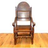 A circa 1910 oak open armchair