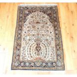 An antique Persian Qum silk rug