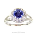 An 18 carat White Gold Tanzanite and Diamond cluster ring.