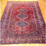 An antique Persian Qashqai carpet