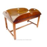 A mahogany butlers tray on stand