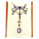 A Gold and Silver Necklace set with Amethyst and Diamonds.